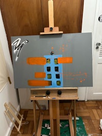 an easel with a painting on it